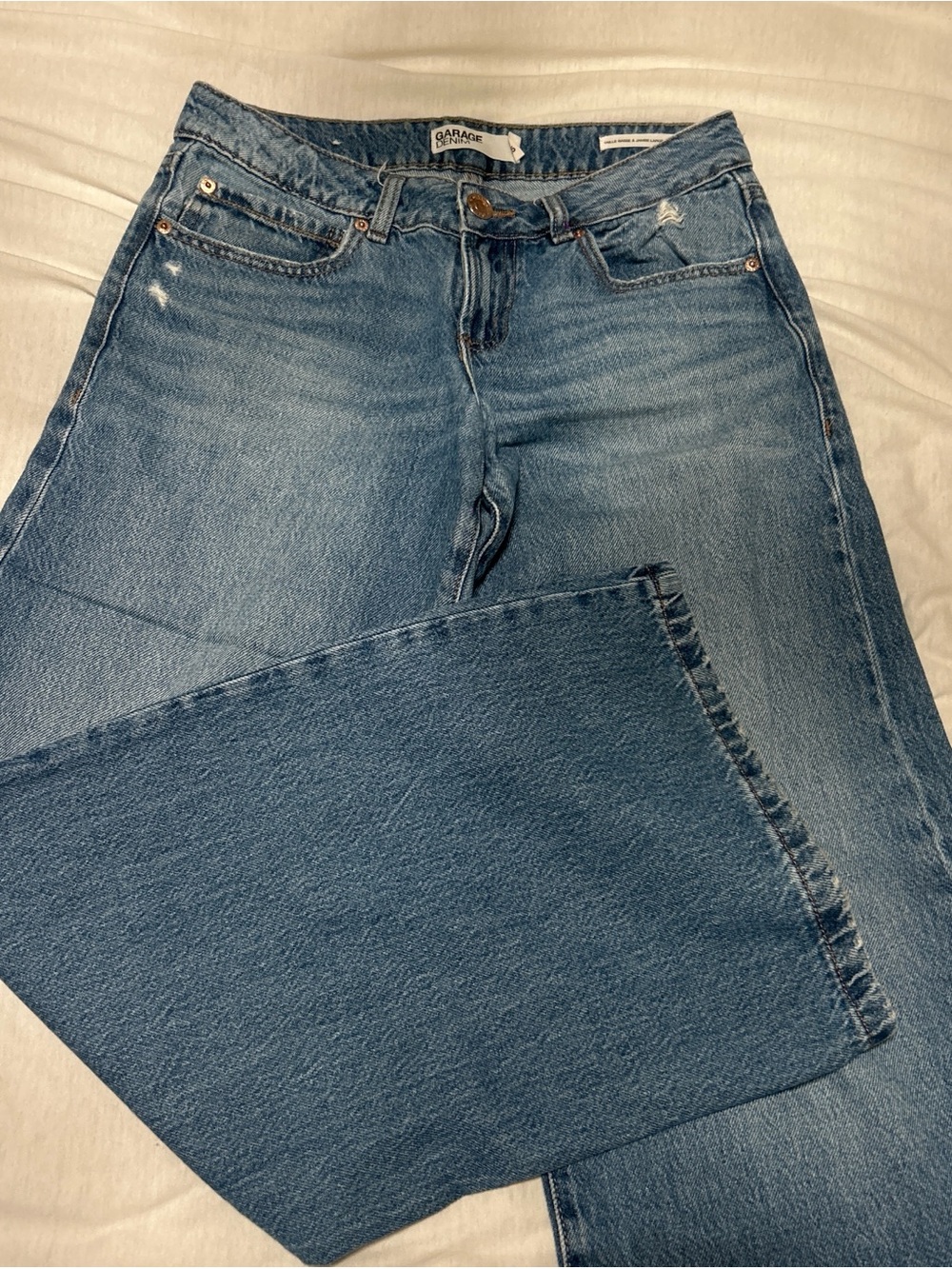 Garage Low-rise Wide-Leg Flare Jeans in Medium Blue Wash